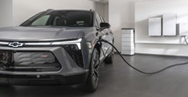A silver Blazer EV charging up