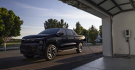 A Silverado EV charging up in the garage